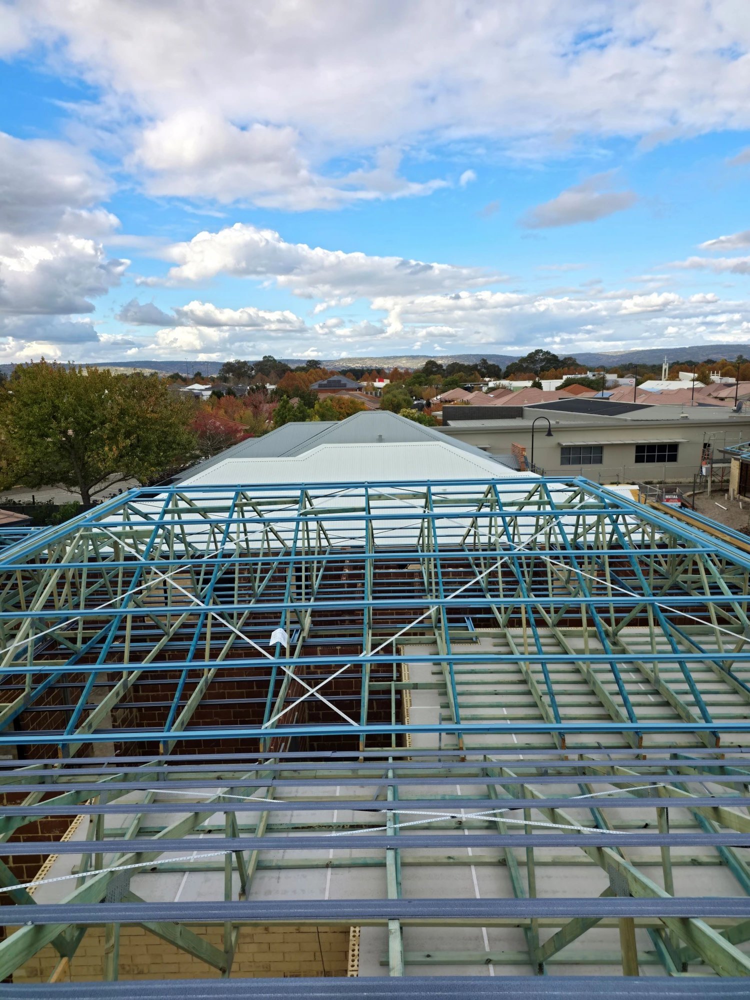 Looking across newly installed roof battens and trusses